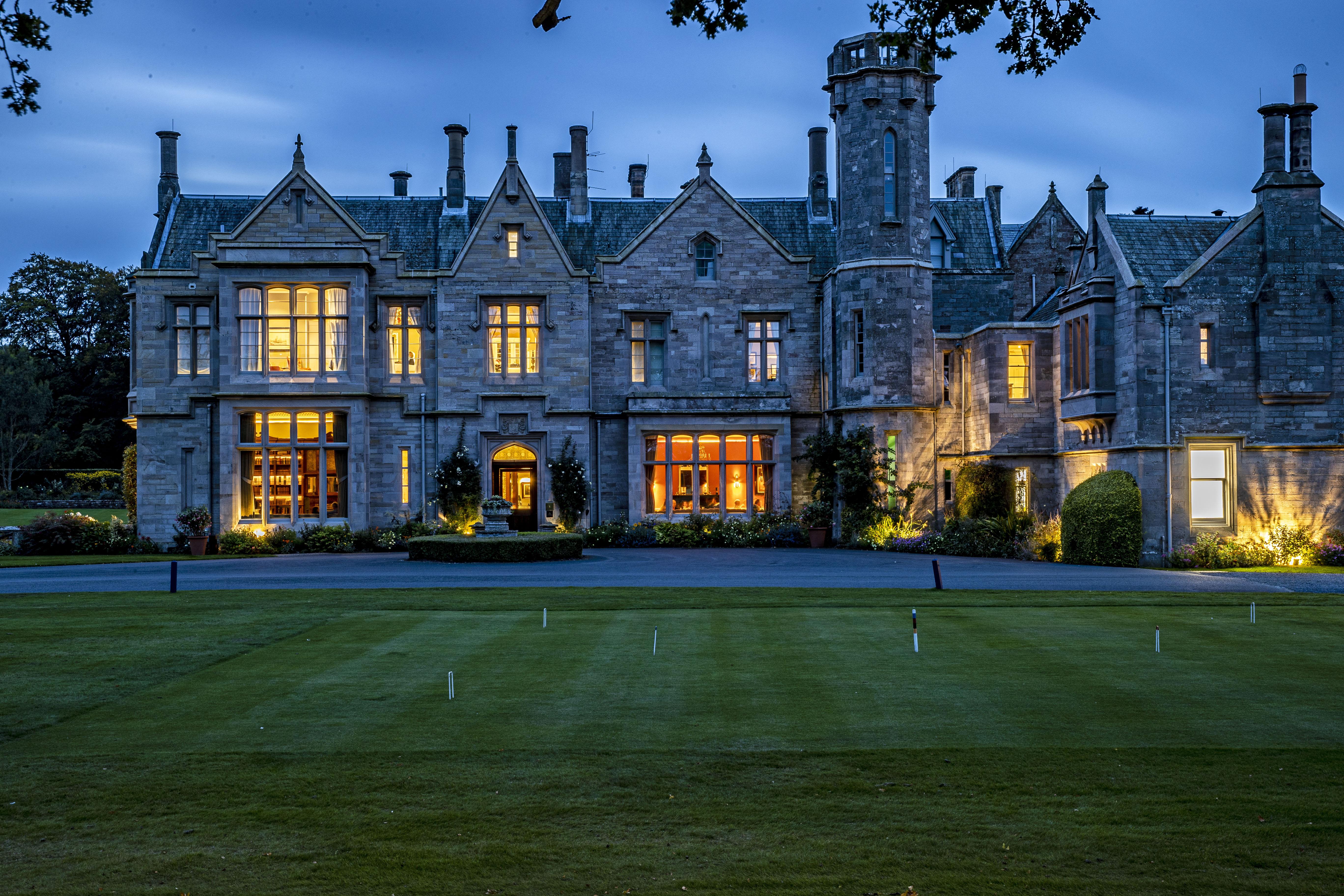 Schloss Roxburghe, Part Of Destination By Hyatt Exterior photo The main house at night